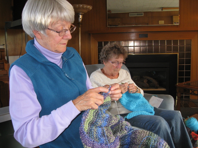 Knitting prayer shawls.